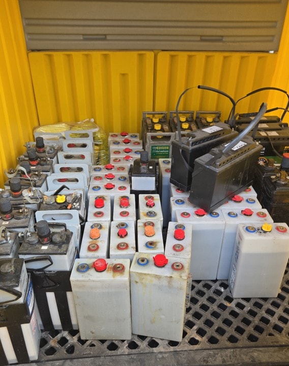 Mixed batteries in collection container before pickup